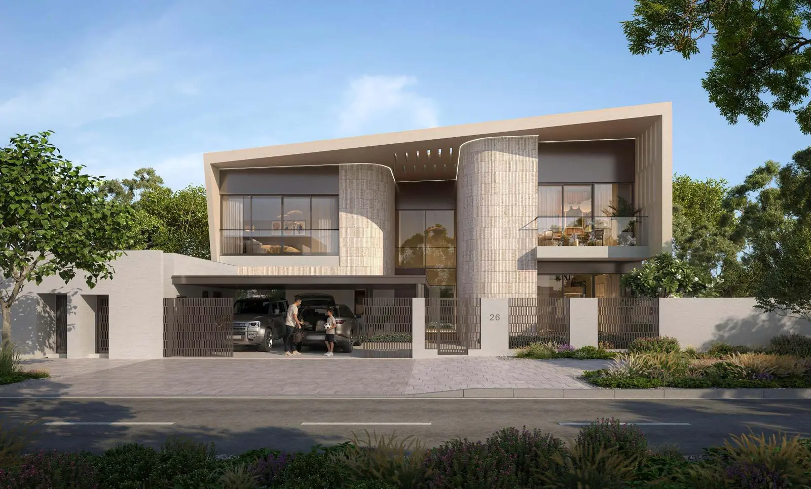 Sunset view of a beachfront Talay villa with warm interior lights glowing through expansive glass doors, open to a private patio and infinity pool.
