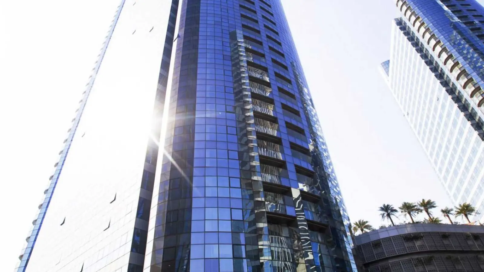 Exterior facade of Omega Tower Al Reem Island Abu Dhabi showing the thirty five storey commercial glazed office building today