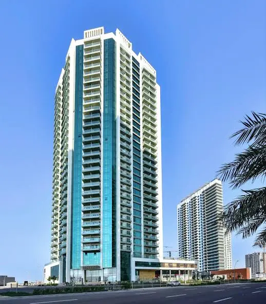 Exterior facade of Sea Side Tower rising above Al Reem Island Abu Dhabi skyline