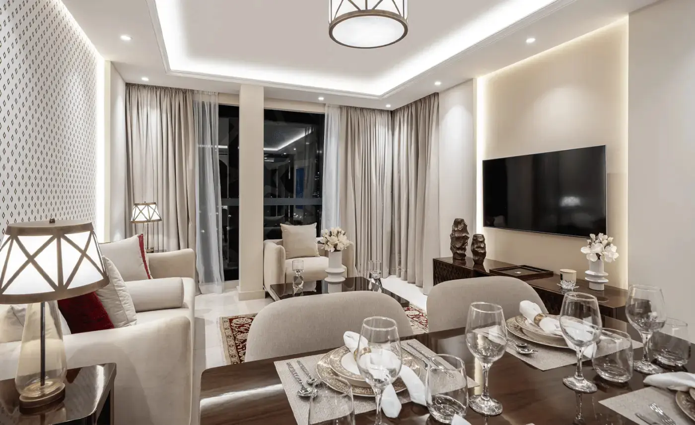 Bright dining area with floor-to-ceiling windows at Bab Al Qasr Residence 25.