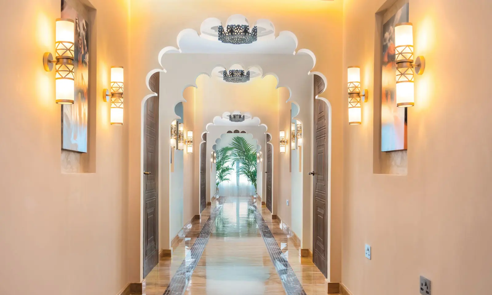 Bab Al Qasr Resort Residence 19 corridor in Masdar City Abu Dhabi with elegant lighting warm tones and refined interior finishes