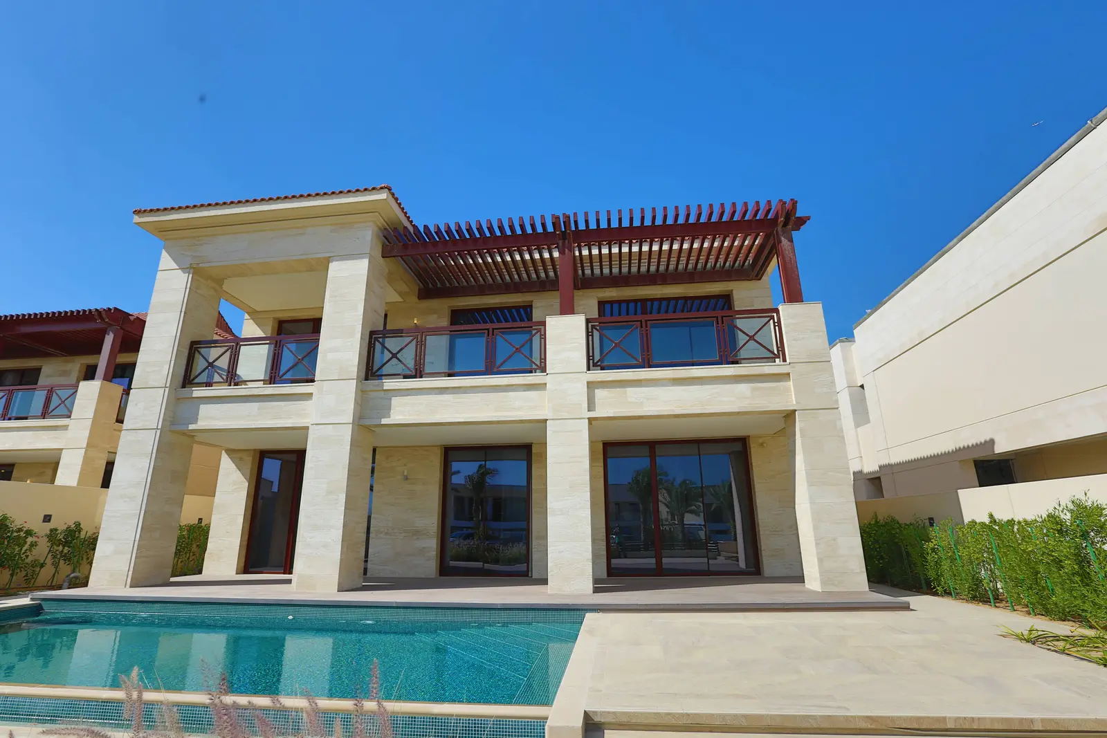 Elegant architecture of Hidd Al Saadiyat villa with landscaped gardens