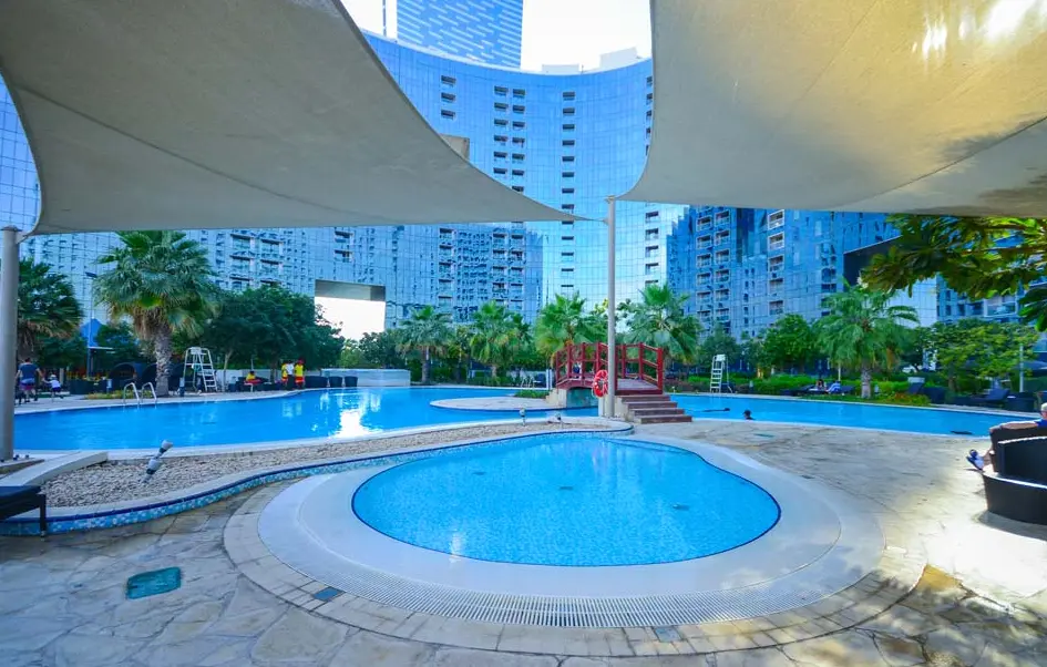 Street view of The Arc Tower on Al Reem Island, highlighting its prominent residential tower profile.