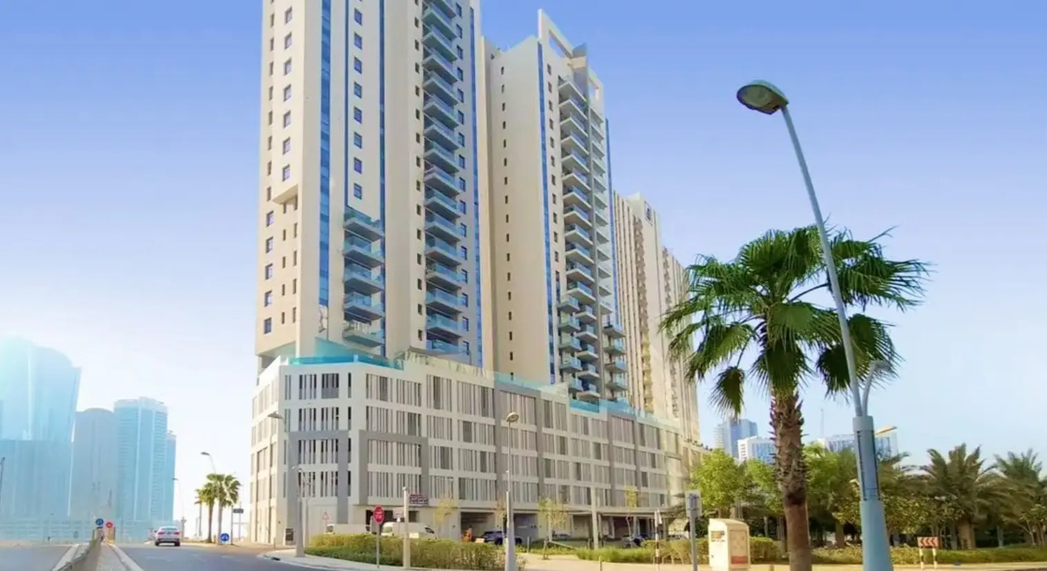 Private balcony framing scenic view of Reem Central Park at Parkside Towers, Shams Abu Dhabi, UAE.