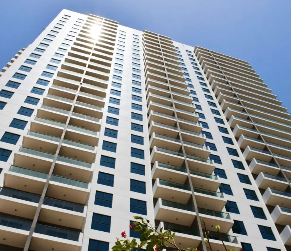 Imposing glass facade and exterior profile of Al Wifaq Tower in Shams Abu Dhabi on Al Reem Island