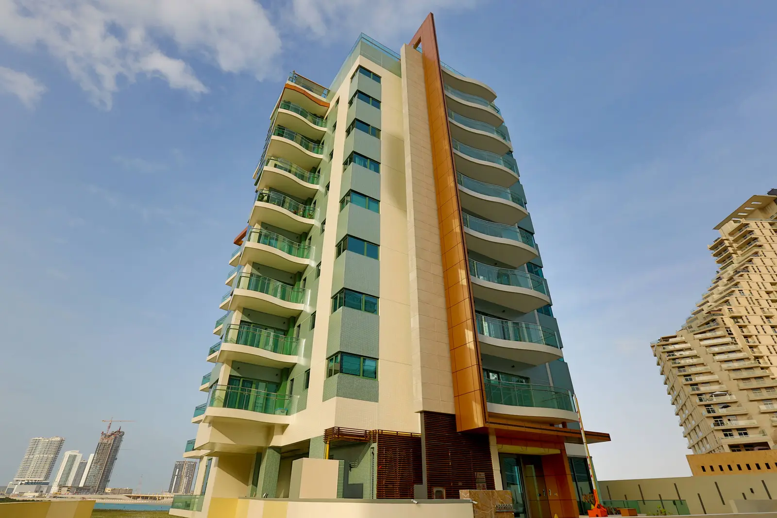 Sleek mid-rise exterior architecture of Reem Diamond building in Shams Abu Dhabi on Al Reem Island with private gardens