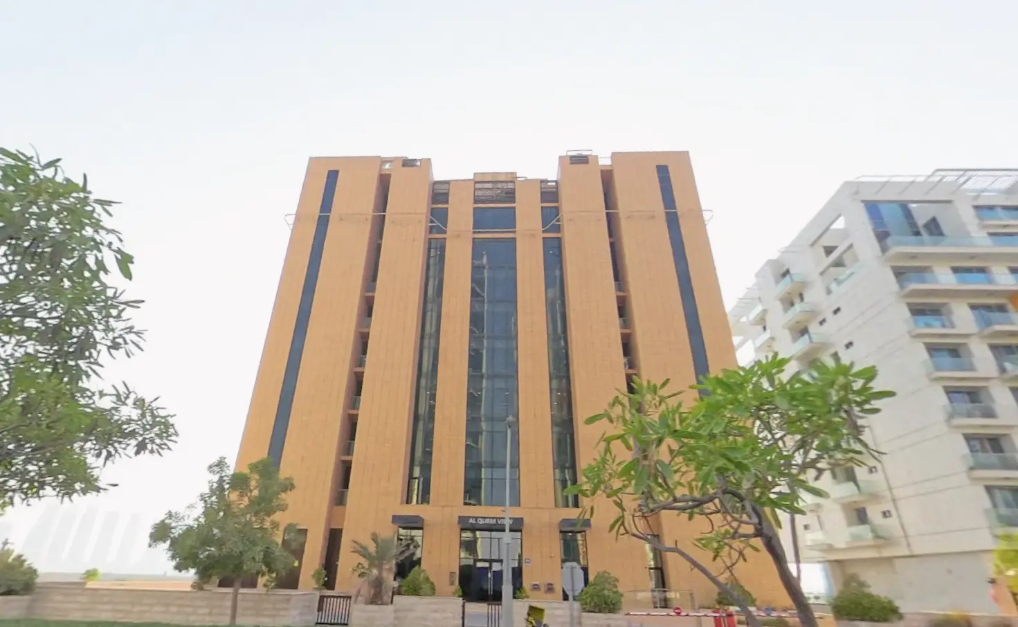 Contemporary facade of Al Qurm View apartments on Al Reem Island Abu Dhabi overlooking protected natural mangrove channels
