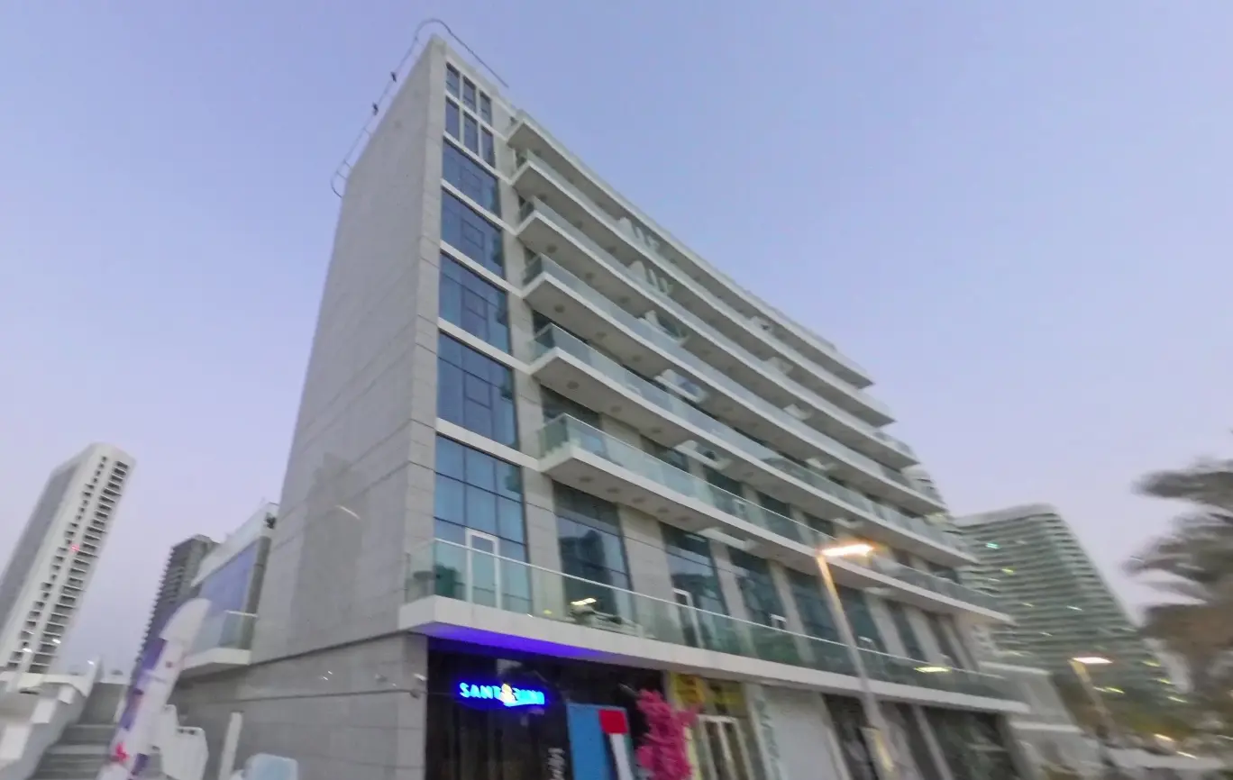 Ground-floor drop-off area and modern architectural podium exterior of By The Sea Tower on Al Reem Island, UAE