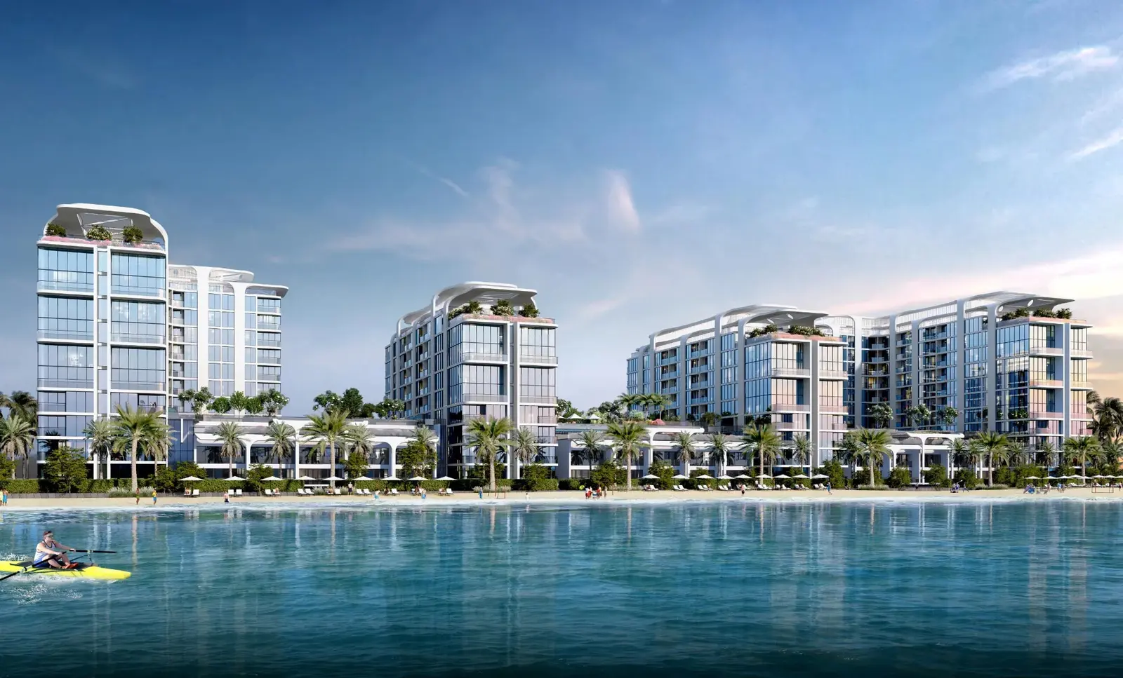 Starline Beach Residences beachfront exterior on Siniya Island, Umm Al Quwain, showcasing modern residential towers beside the sea.