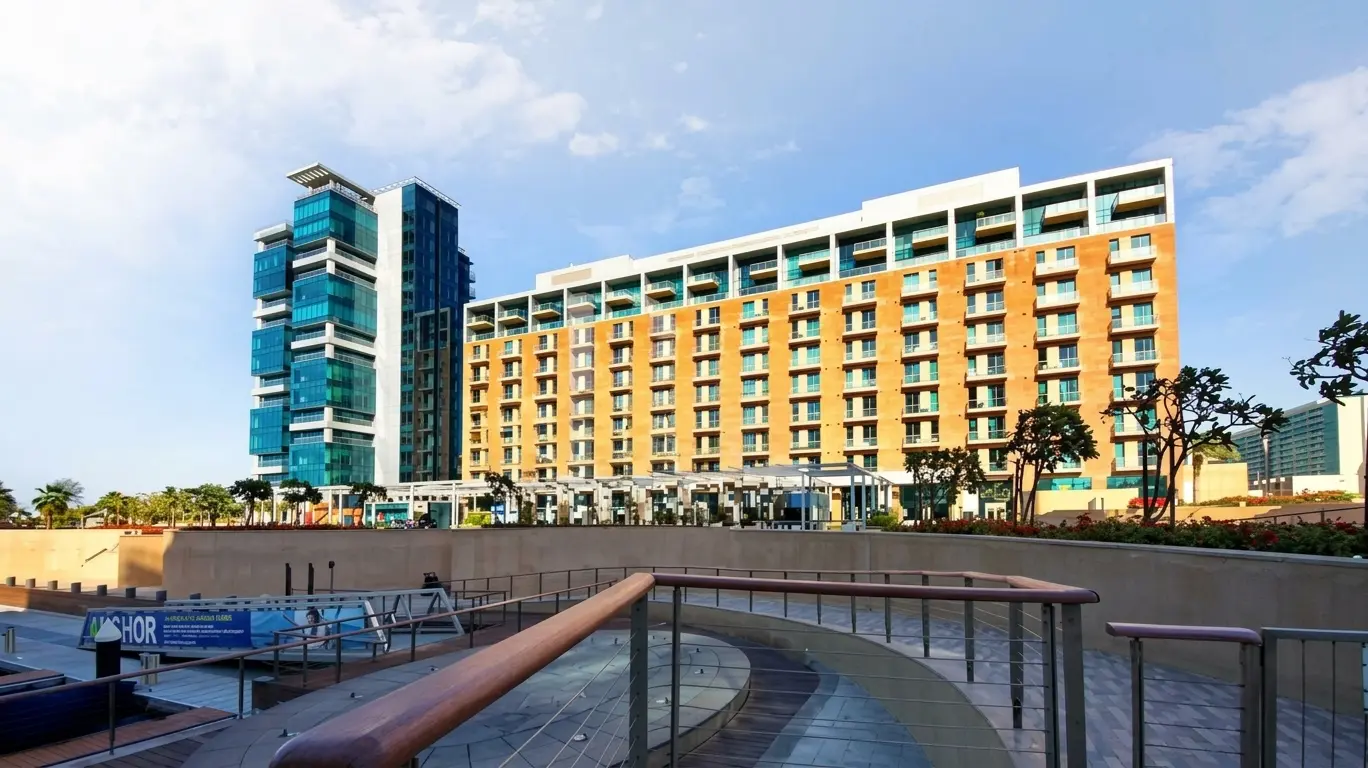 Direct shoreline elevation showing seamless pedestrian integration with marina promenades at Al Barza Residences in Abu Dhabi
