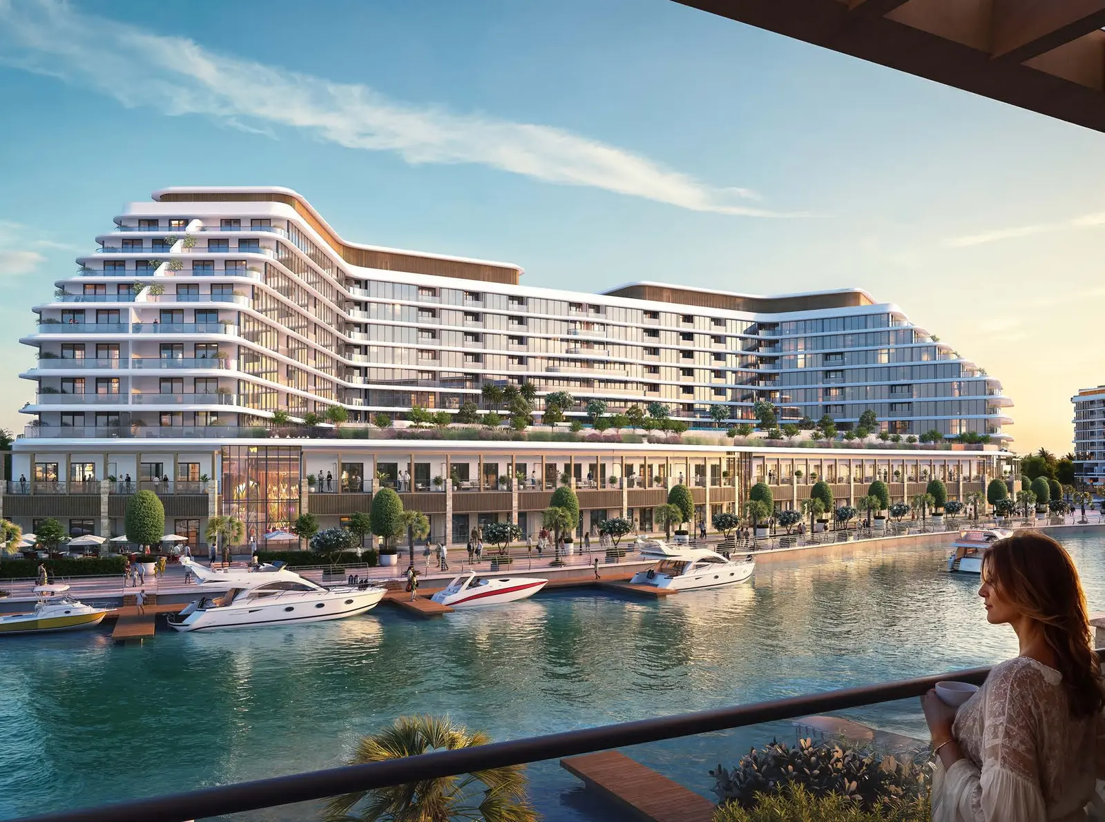 Balcony view overlooking luxury marina promenade, berthed yachts, and residential architecture at Capeside Marina Residences Sobha Siniya Island.