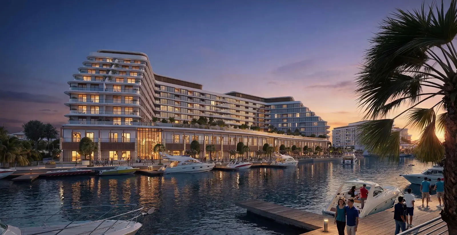 Dusk architectural view of waterfront residential towers and private boat marina at Capeside Marina Residences Sobha Siniya Island.