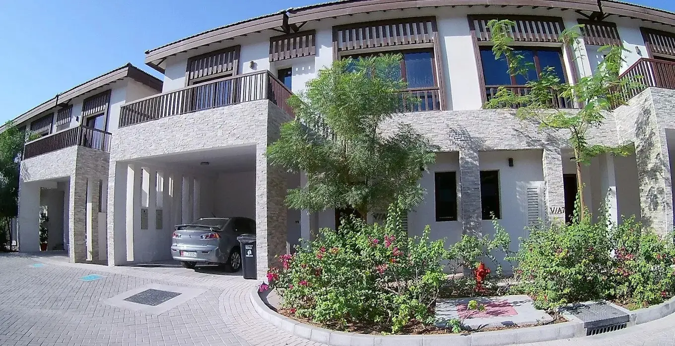 Private enclosed garden lawn and patio area ideal for outdoor relaxation at Nalaya Najmat Al Reem Island