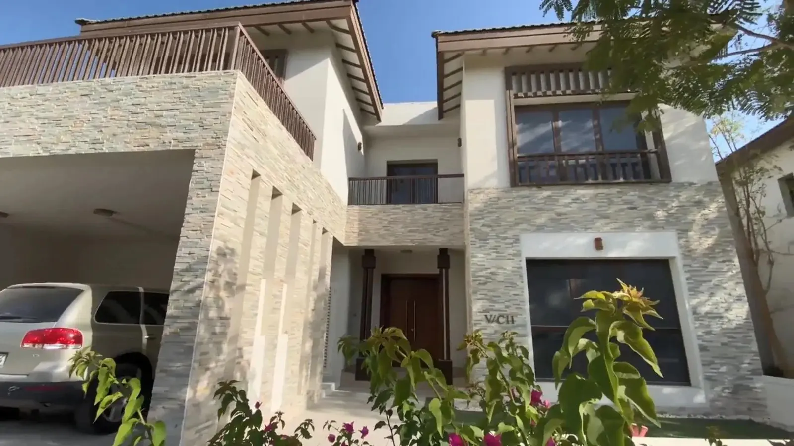 Twilight exterior illumination highlighting private villa balconies and garden terraces at Nalaya Najmat Al Reem Island
