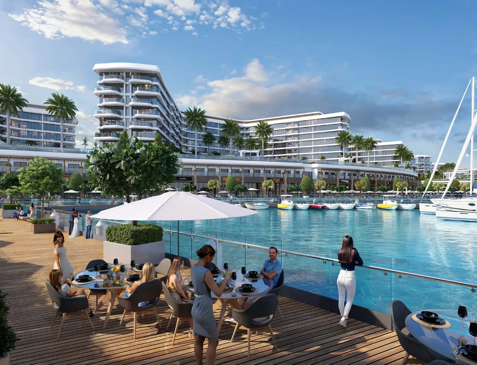 Yachtside Marina Residences at Sobha Siniya Island outdoor dining terrace overlooking vibrant marina canal and yachts