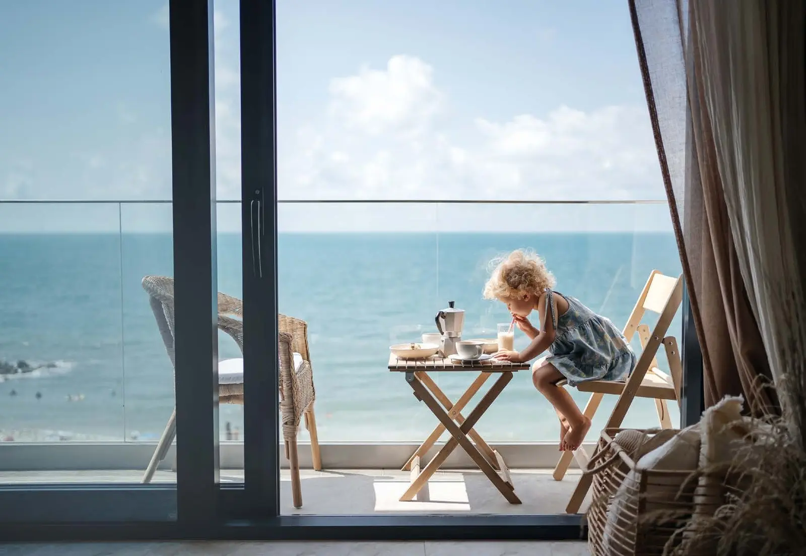 Yachtside Marina Residences at Sobha Siniya Island apartment balcony breakfast table framing breathtaking open sea views