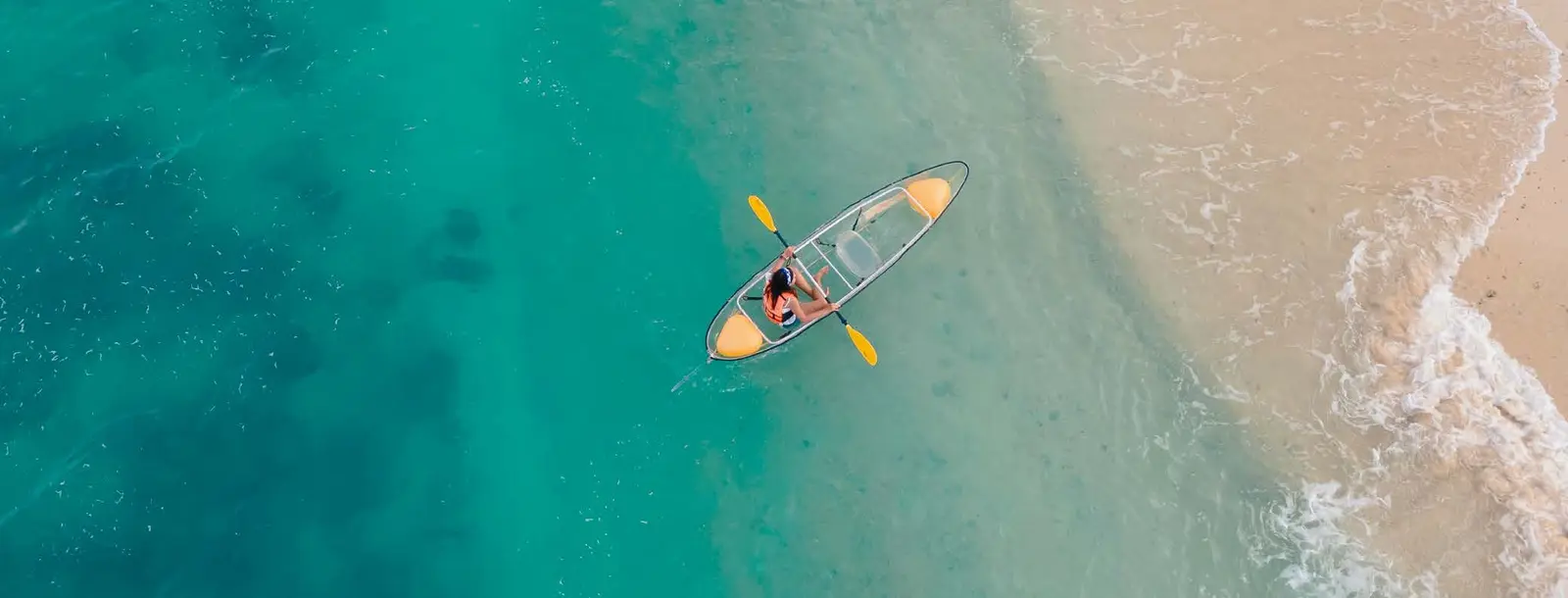 Yachtside Marina Residences at Sobha Siniya Island Umm Al Quwain crystal clear waters kayaking water sport lifestyle