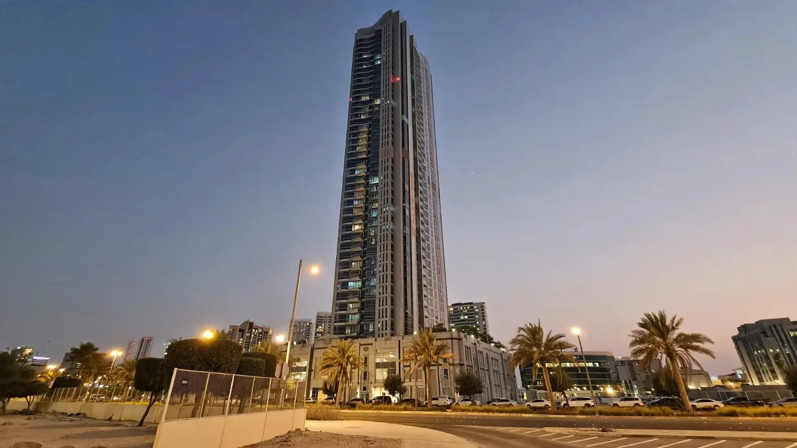 Al Muhaimat Tower panoramic exterior view highlighting its glass windows, tower structure and modern design on Al Reem Island.