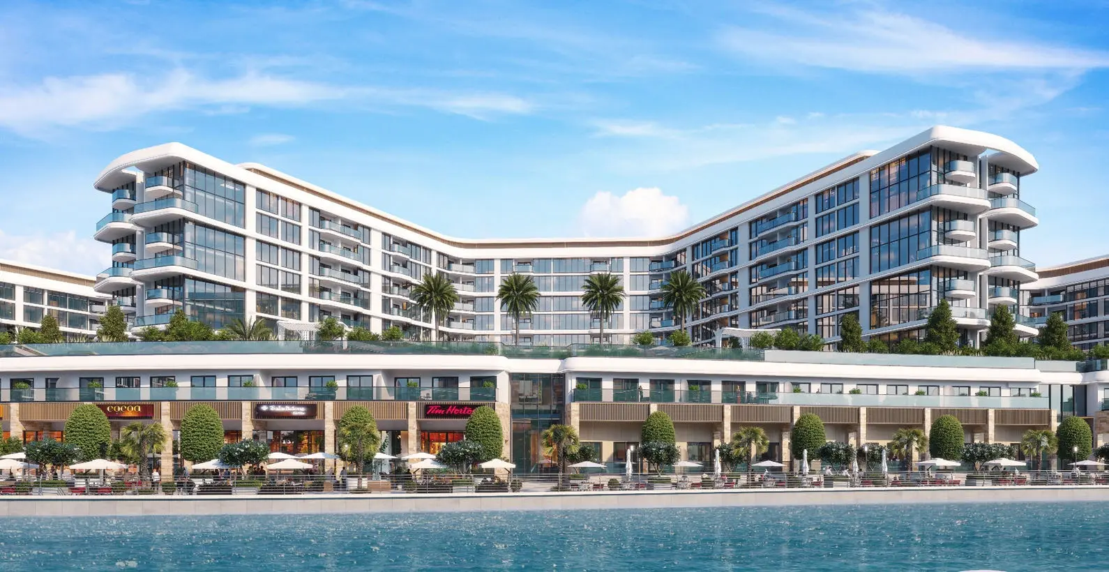 Front view of luxury residential building facade with retail shops below at Bayside Marina Residences on Sobha Siniya Island