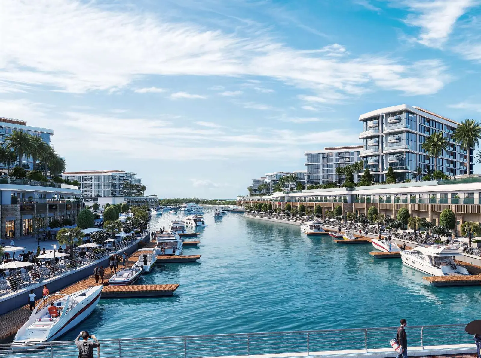 Daytime view of motorized seawater canal and modern apartment facades at Pierside Marina Residences Sobha Siniya Island UAQ