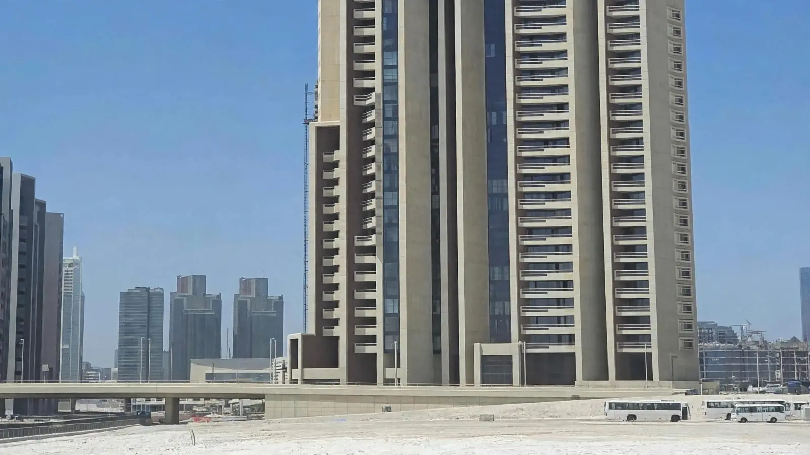 Najmat Abu Dhabi Baheen Tower exterior lifestyle highlighting sleek architecture, vibrant surroundings, and waterfront residential tower.