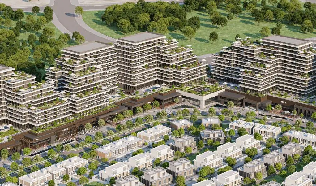 Exterior view of modern residential towers at Majlis Reem Hills Abu Dhabi surrounded by landscaped gardens and palm trees.
