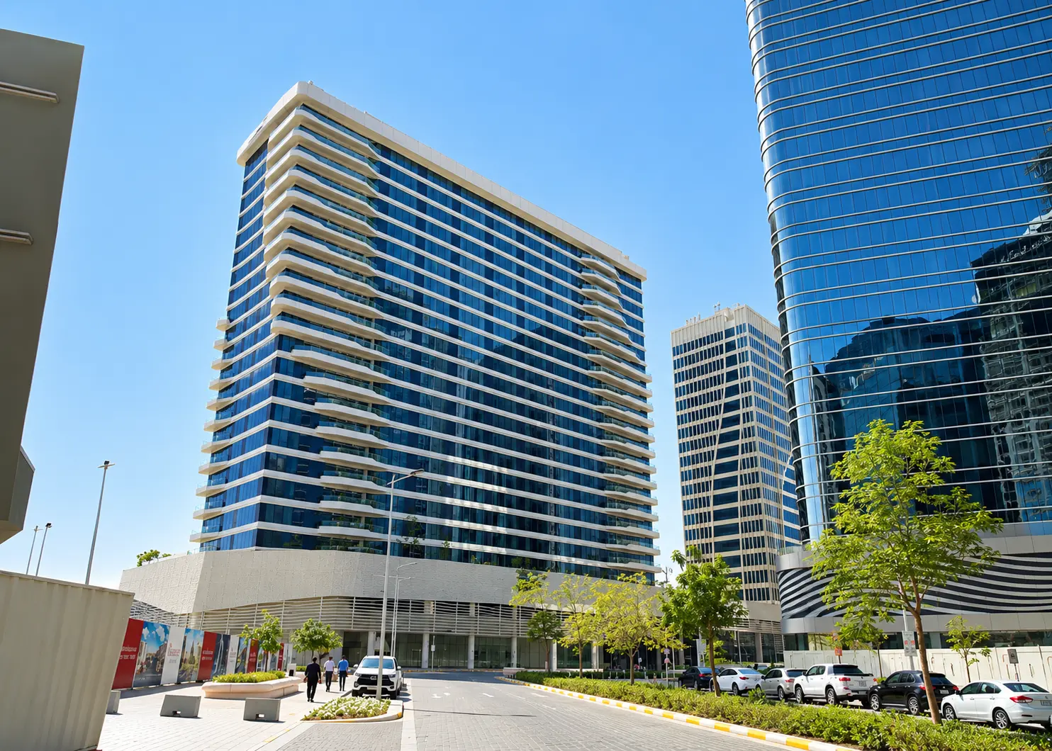Modern Glass Towers Over a Sunlit Plaza
