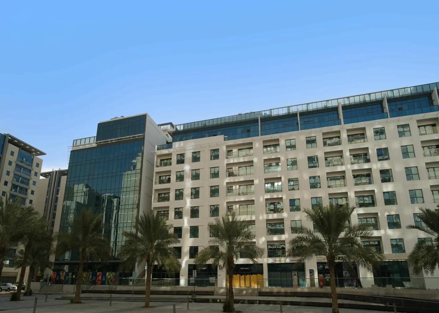 Al Faridah residential property exterior in Al Zeina, Al Raha Beach, Abu Dhabi, highlighting the apartment building structure.