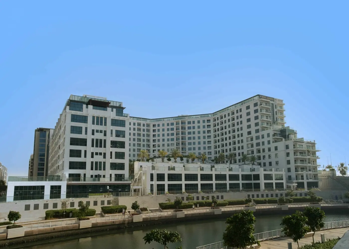 Al Faridah apartment building facade in Al Zeina, Al Raha Beach, Abu Dhabi, featuring residential architecture and exterior design.