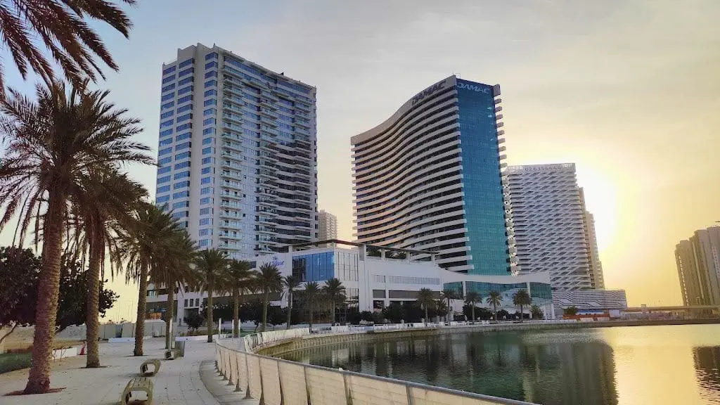 Front view of coastal luxury apartment building The Wave situated along the waterfront promenade in Abu Dhabi.