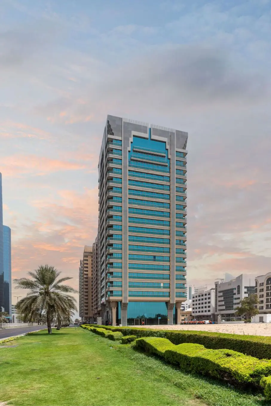 Al Heel Tower high-rise exterior architecture featuring glass windows and contemporary design in Abu Dhabi.