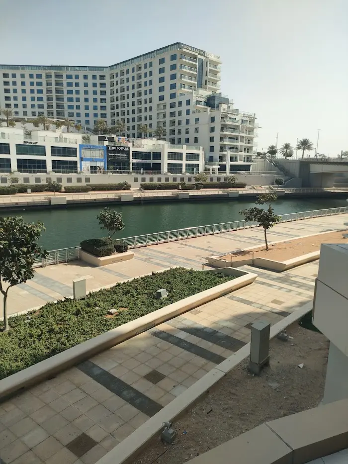 Al Saada Building by Abu Dhabi Commercial Properties (ADCP), showcasing its residential exterior in Al Raha Beach, Abu Dhabi.