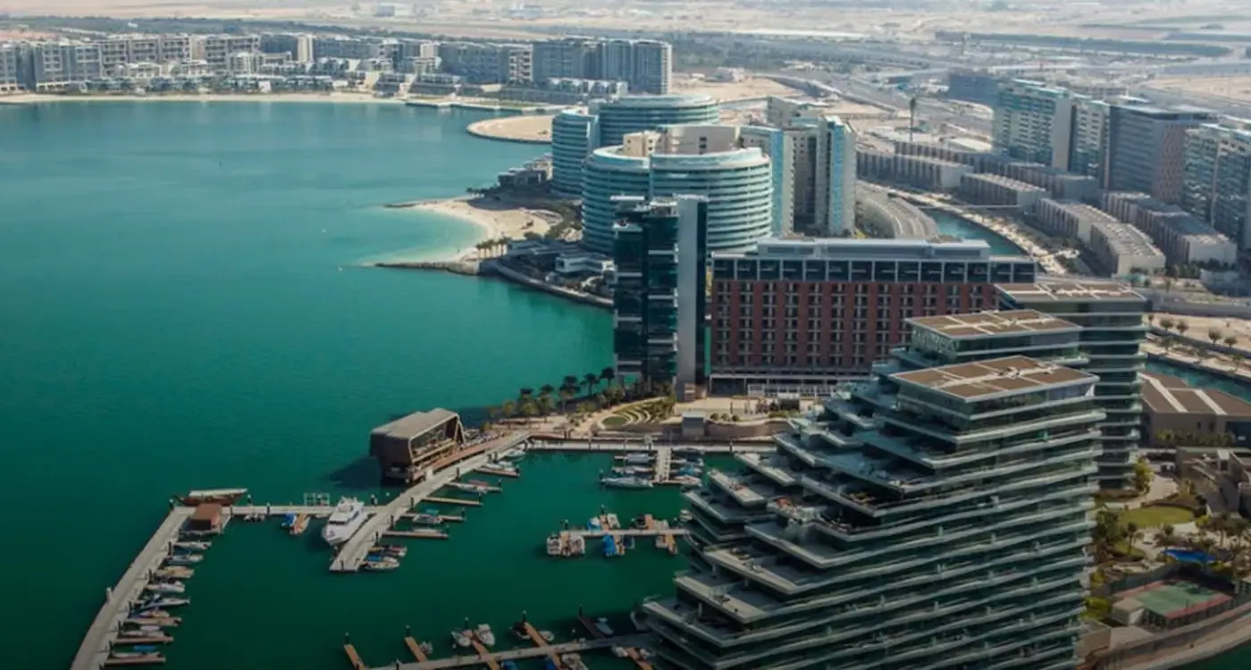 Al Jawzaa Tower building entrance and surrounding exterior area in Al Raha Beach. 0a54 7305 b237 3398d32affe3AlRahaBeachCover