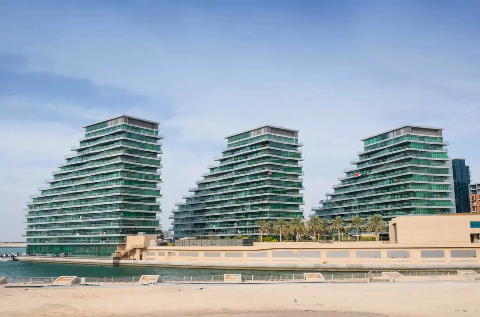 Al Jawzaa Tower residential façade featuring modern architectural design in Al Raha Beach