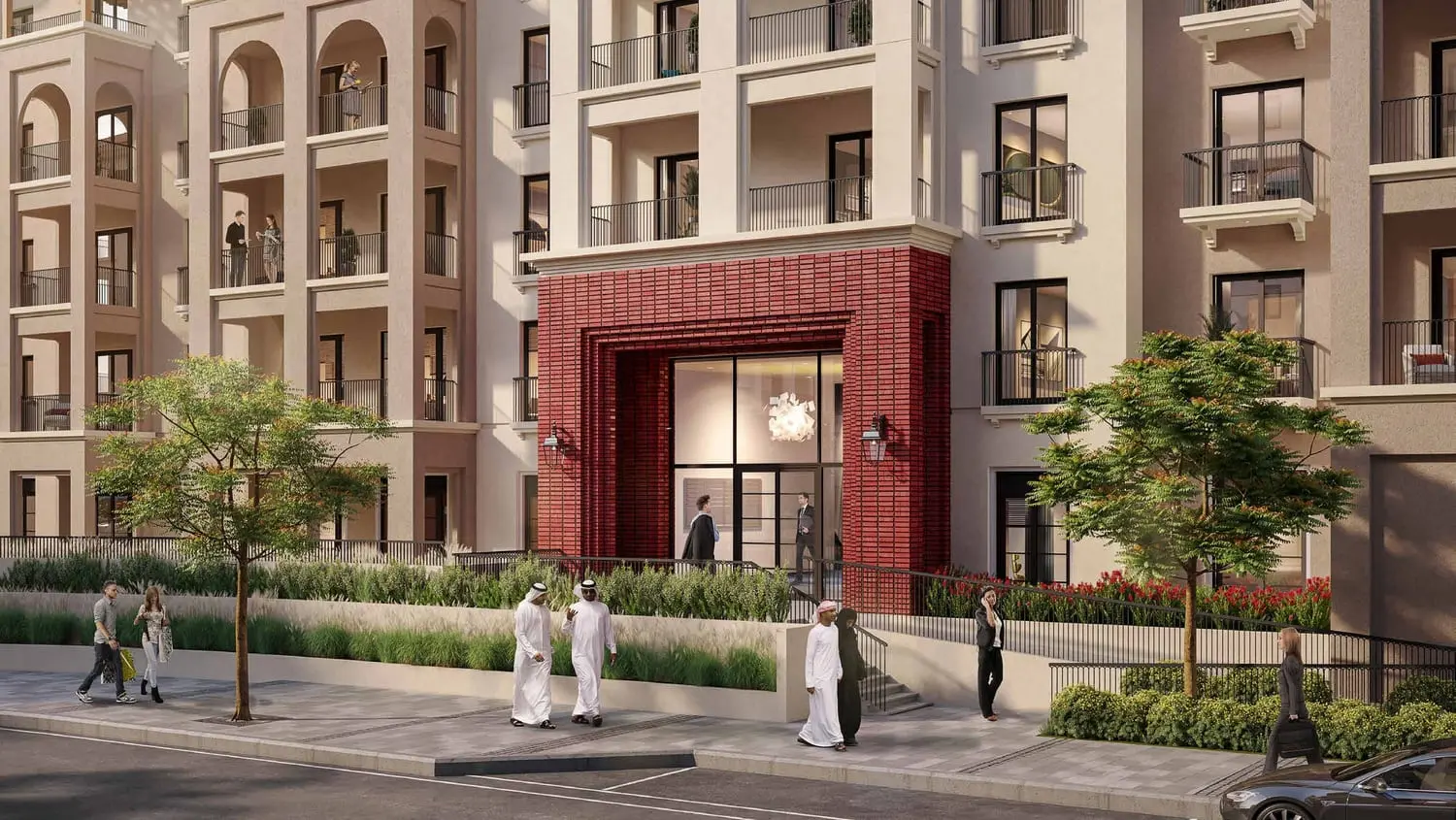 Granada residential cluster exterior with walkway connecting to Bloom Living community parkland, Abu Dhabi.