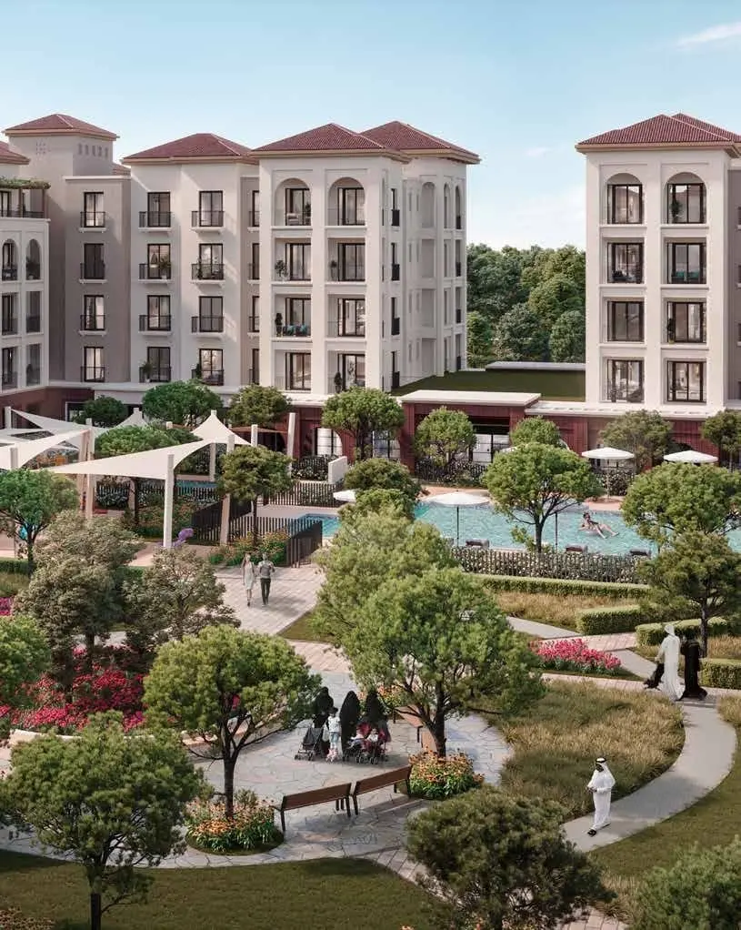Exterior courtyard view of Granada apartments showcasing landscaped gardens within Bloom Living Abu Dhabi.