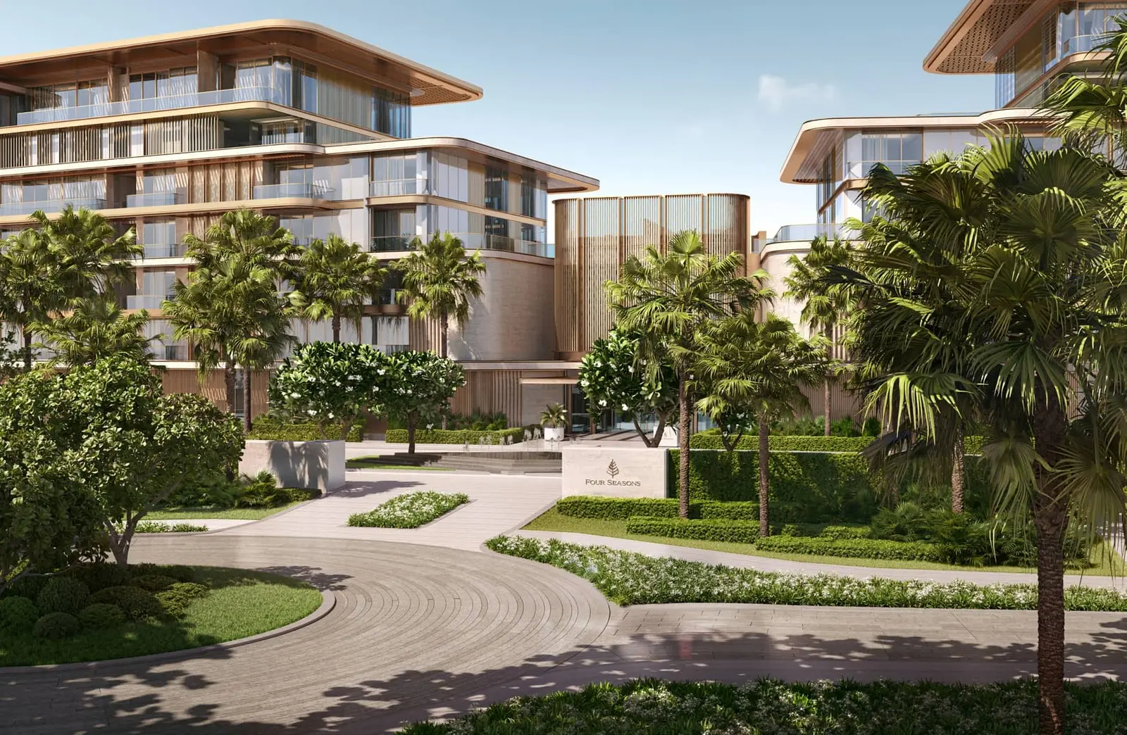 Sunset view of Four Seasons Private Residences Saadiyat Island with beachfront pathways and serene coastal ambiance.