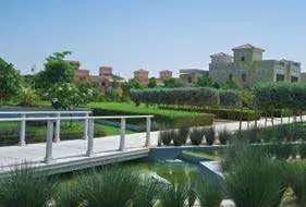 Lush landscaped gardens at The Reserve Al Barari Dubai showcasing luxury villas in Nad Al Sheba community.jpg