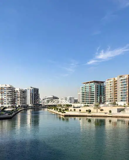 Night view of Bab Al Qasr Canal View Residence 22 Abu Dhabi exterior illuminated with elegant waterfront lighting.jpg