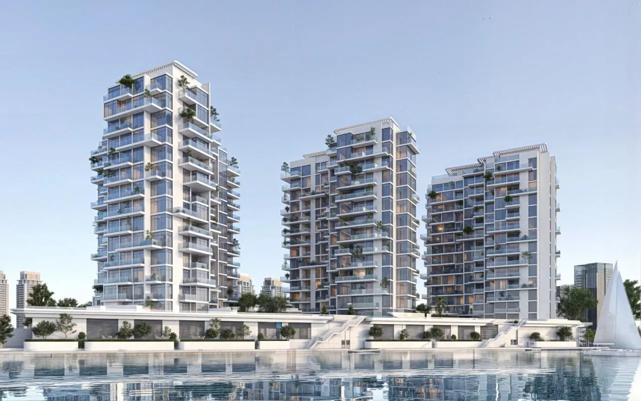 Stunning waterfront exterior view of Bab Al Qasr Canal View Residence Al Raha Beach Abu Dhabi overlooking canal and skyline.jpg