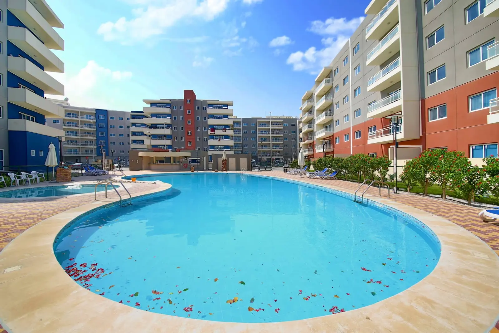 Resort-style swimming pool at Al Reef Downtown, Al Reef Abu Dhabi featuring luxury residential amenities and modern apartment community living