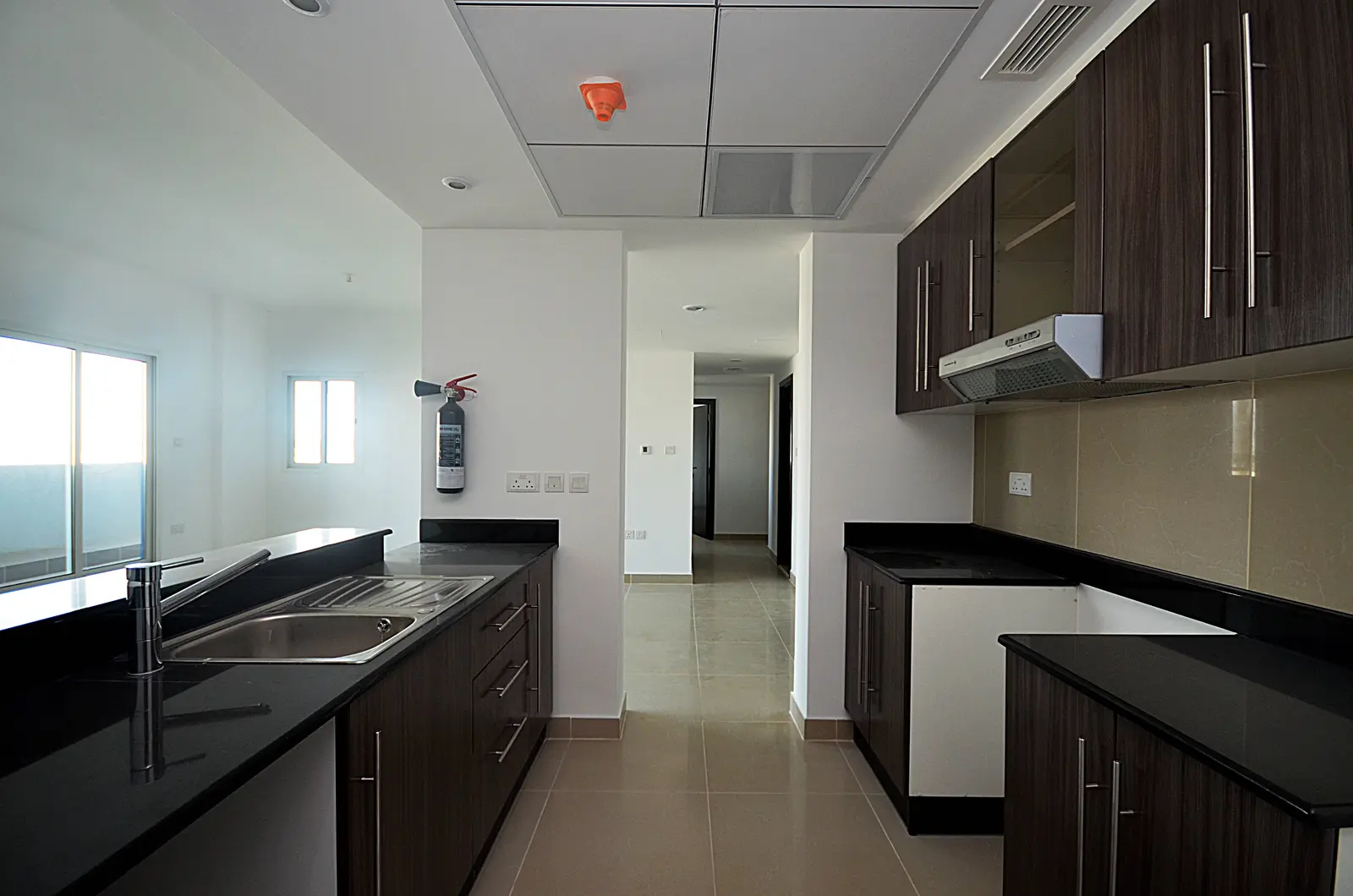 Master bedroom at Al Reef Downtown, Al Reef Abu Dhabi featuring built-in wardrobes and abundant natural lighting for relaxing living spaces