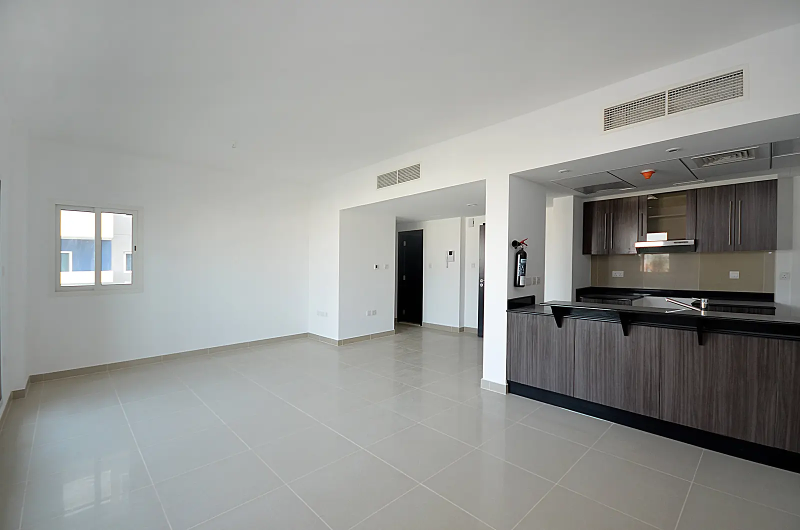 Elegant dining area at Al Reef Downtown apartments in Abu Dhabi designed for comfortable family living experiences and entertaining guests