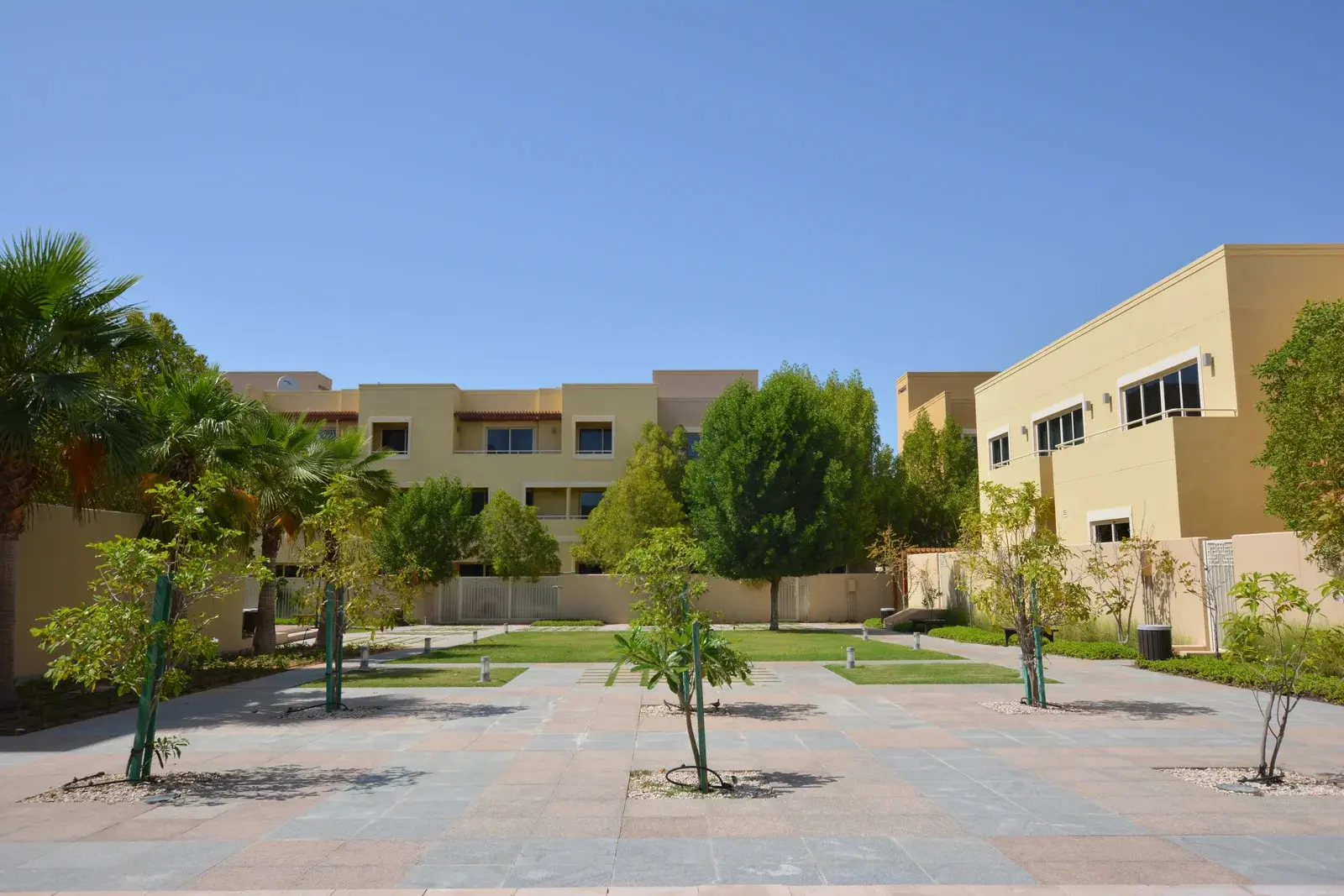 Modern architecture of a villa in Al Raha Gardens, Abu Dhabi, featuring large windows and elegant facades.