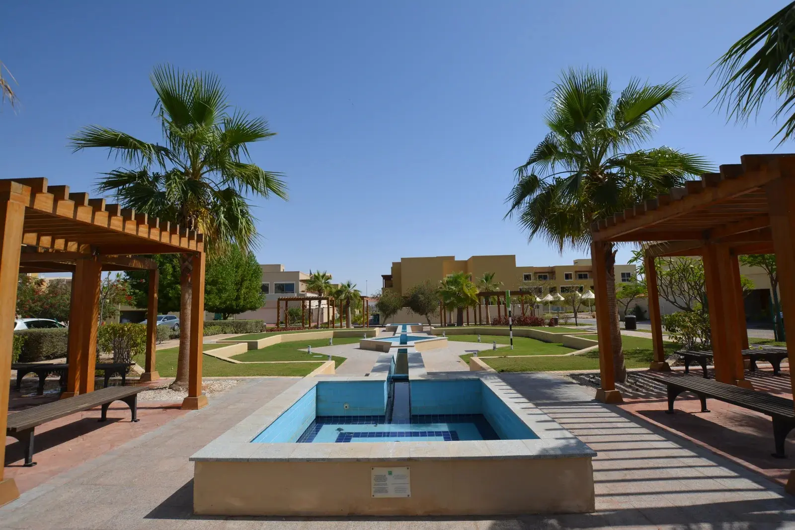 Exterior of a luxurious villa in Al Raha Gardens, Abu Dhabi, showcasing modern design and lush landscaping.