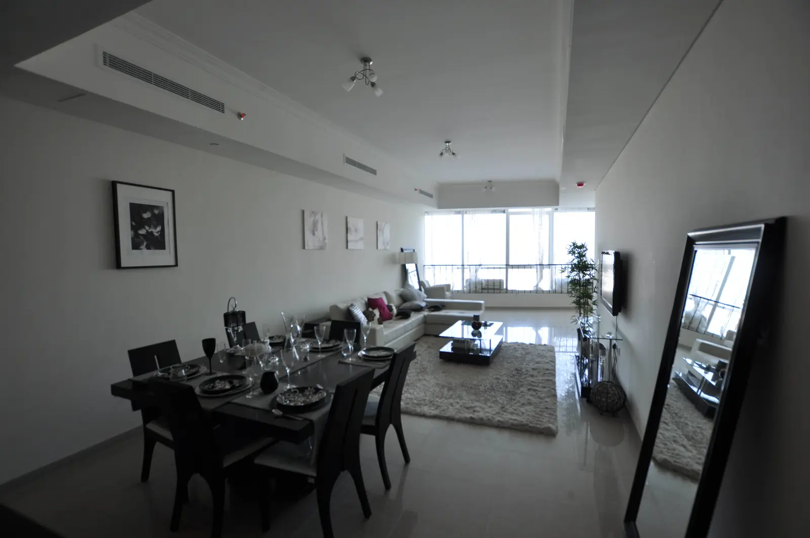 Modern living room at Hydra Avenue Al Reem Island apartment featuring contemporary interiors and elegant waterfront lifestyle