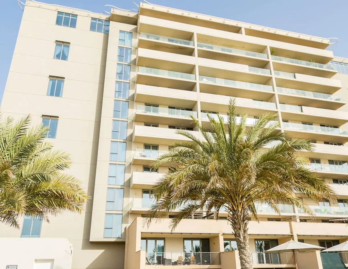 Al Dana master plan in Al Raha Beach Abu Dhabi featuring waterfront residences, townhouses, landscaped spaces, bridges, and community amenities