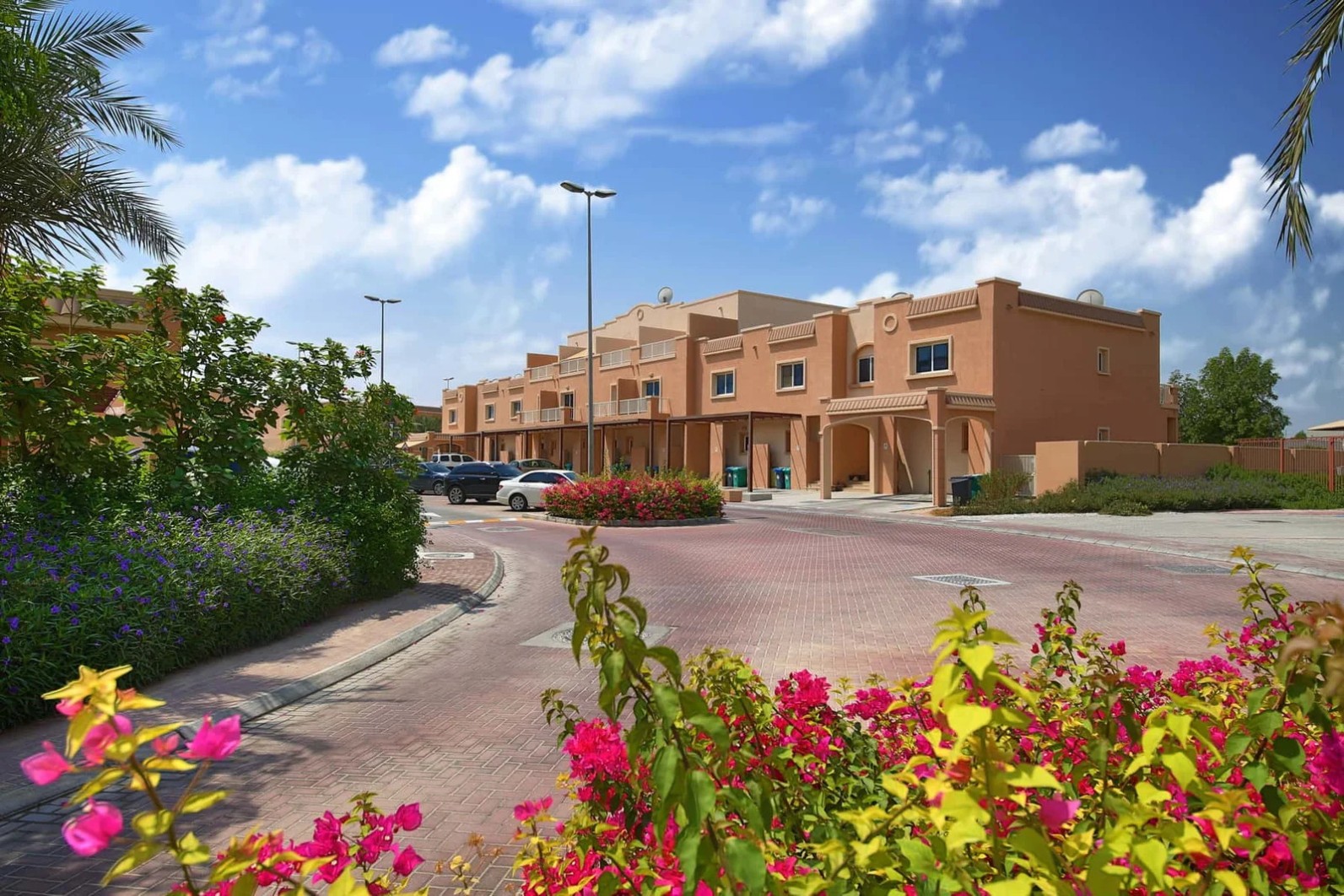 Beautiful Arabian-style villas in a family-friendly gated community with modern amenities and lush surroundings.